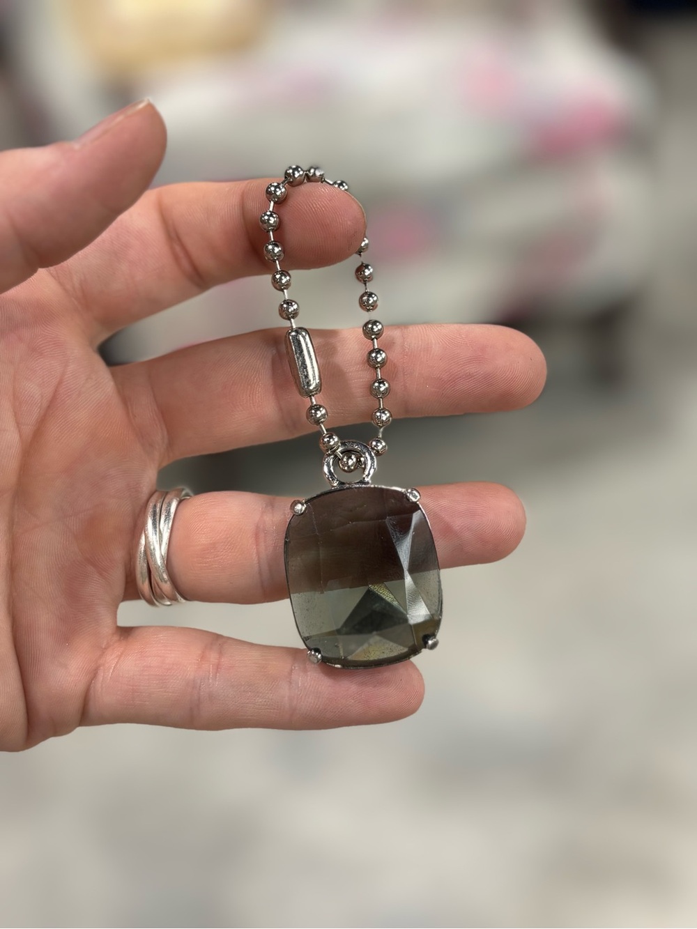 Coach dark grey gem purse charm